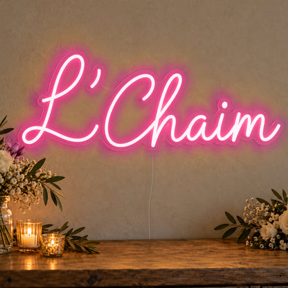 L’Chaim Neon Sign in rose red LED neon on clear acrylic, angled view