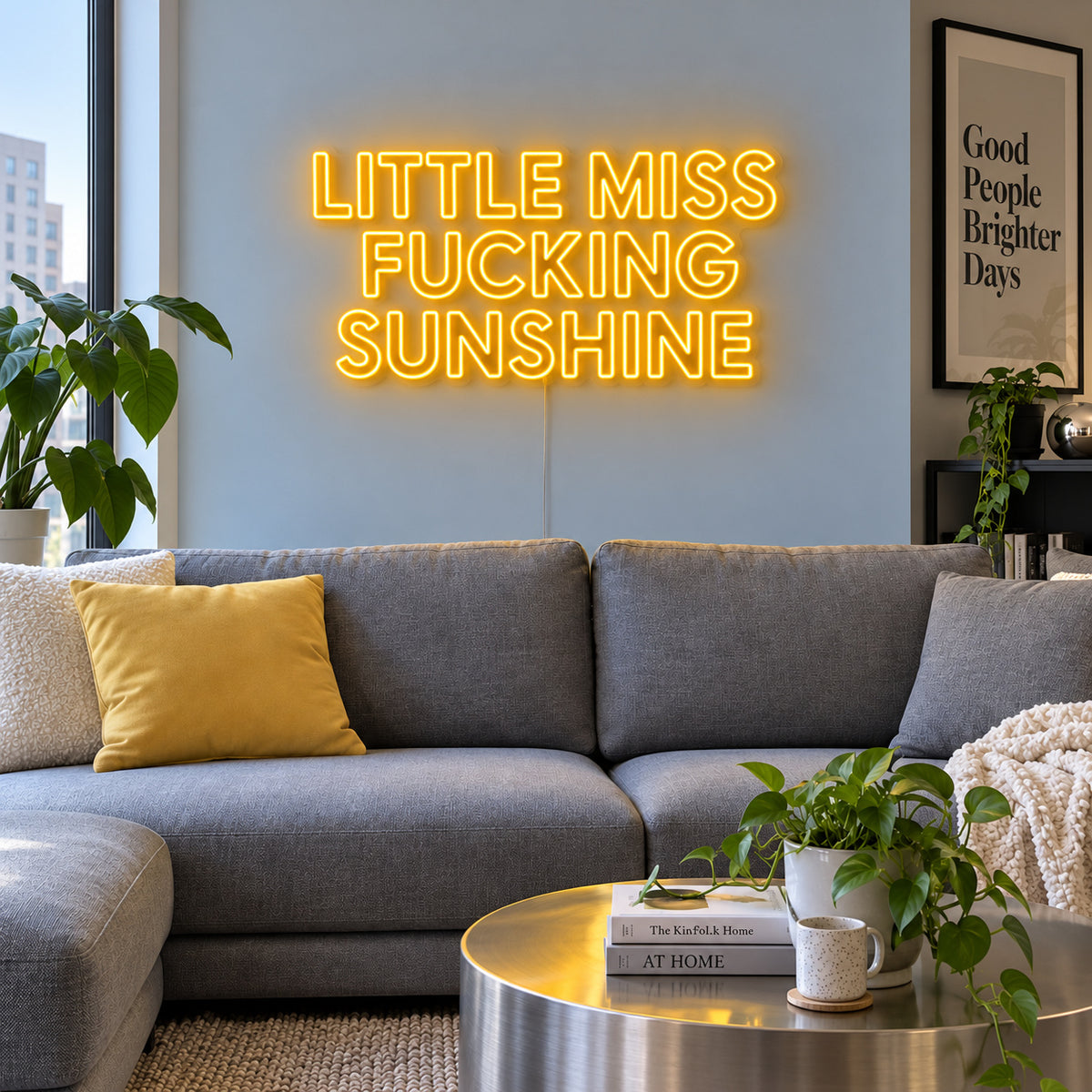 Little Miss Fucking Sunshine Neon Sign glowing gold above a grey sofa with yellow cushions.