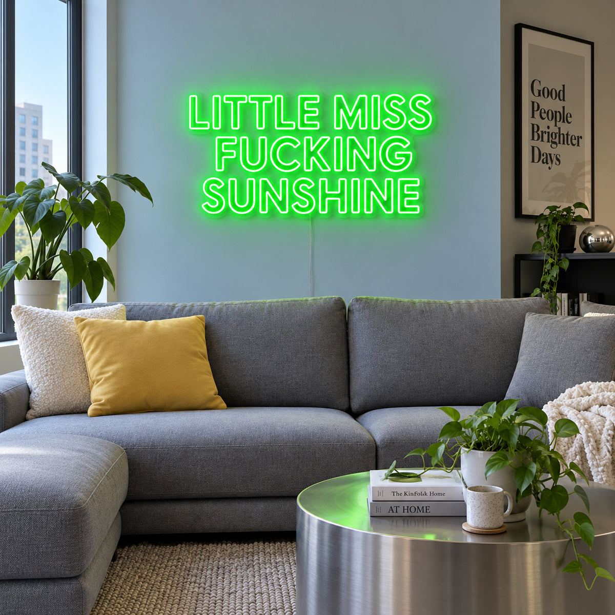 Little Miss Fucking Sunshine Neon Sign with green lighting, displayed above a grey sofa with yellow cushions.
