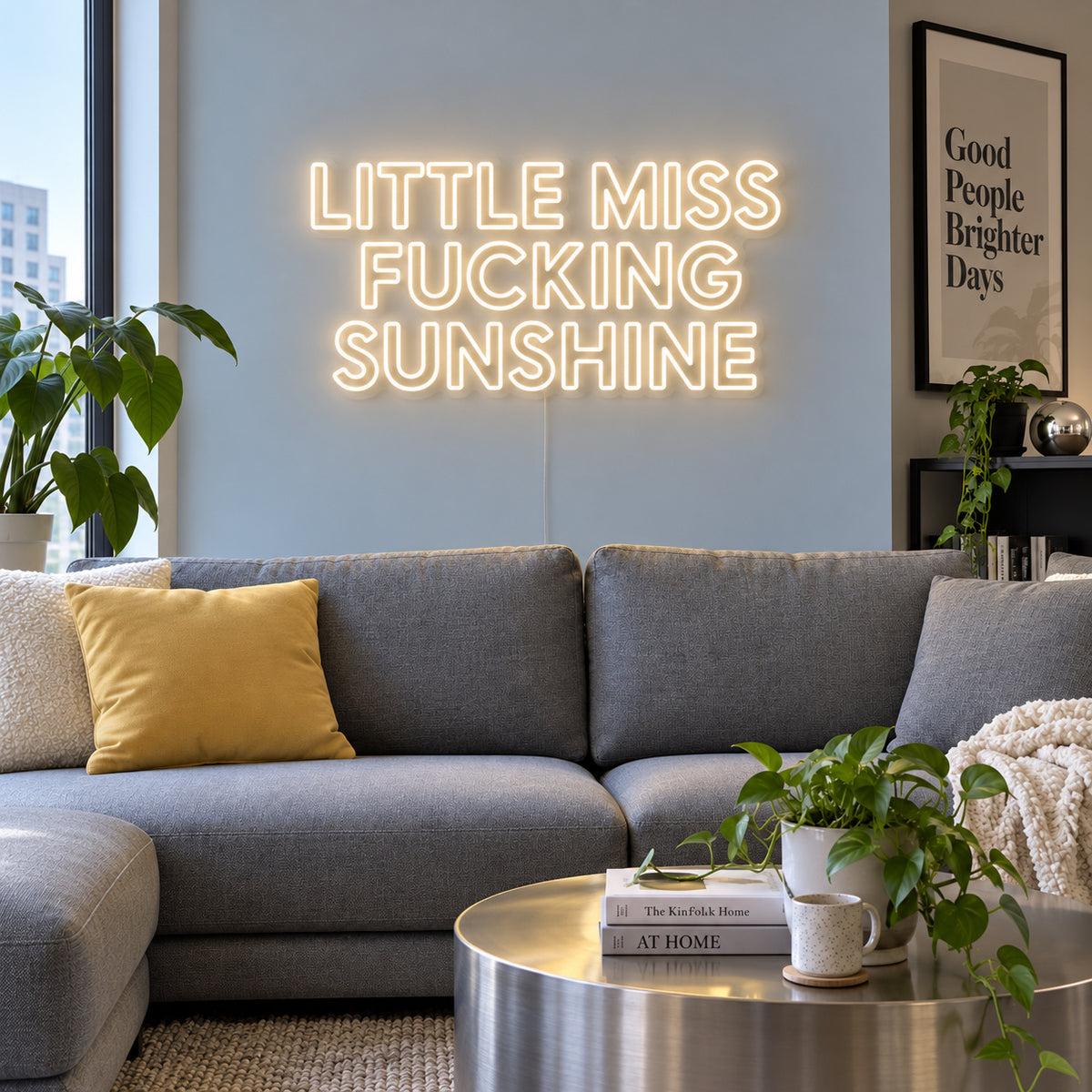 Warm White version of the Little Miss Fucking Sunshine Neon Sign, shown above a grey sofa with yellow cushions.