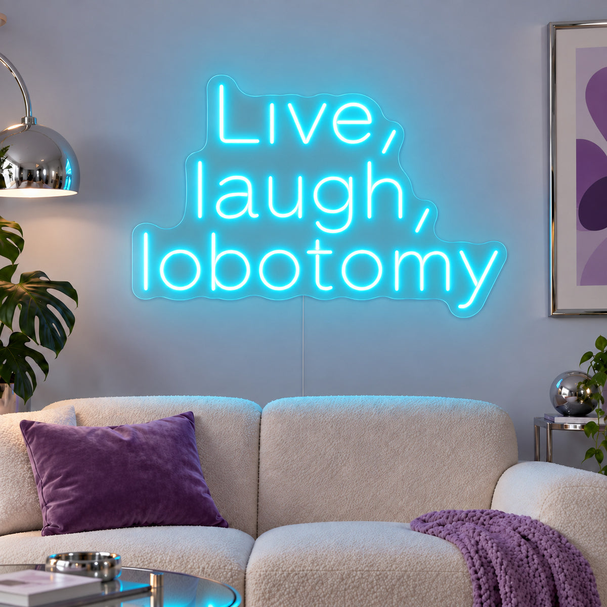 Ice Blue version of the Live, Laugh, Lobotomy Neon Sign, shown above a cream sofa with purple cushions.