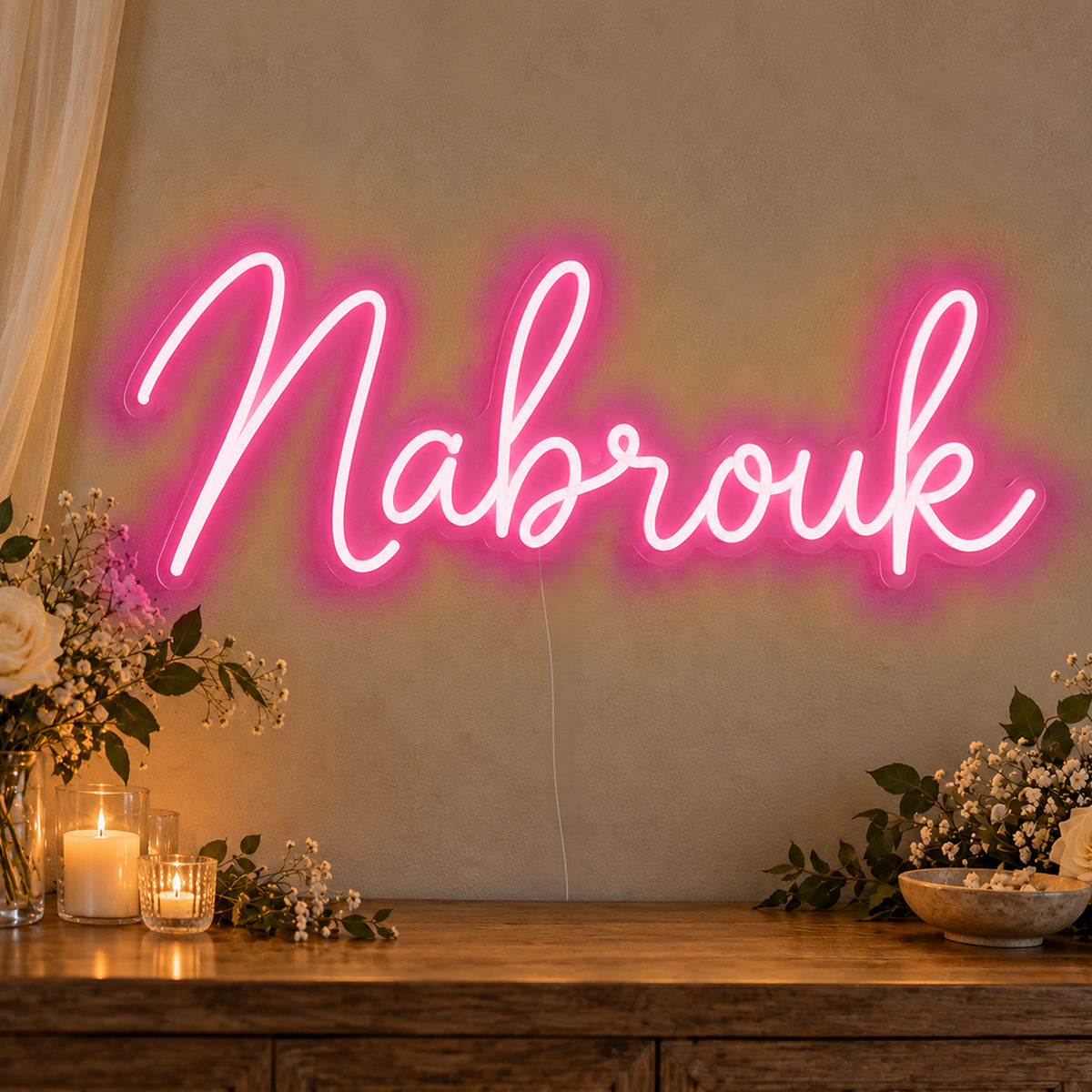 Mabrouk Neon Sign in rose red LED neon on clear acrylic, angled view