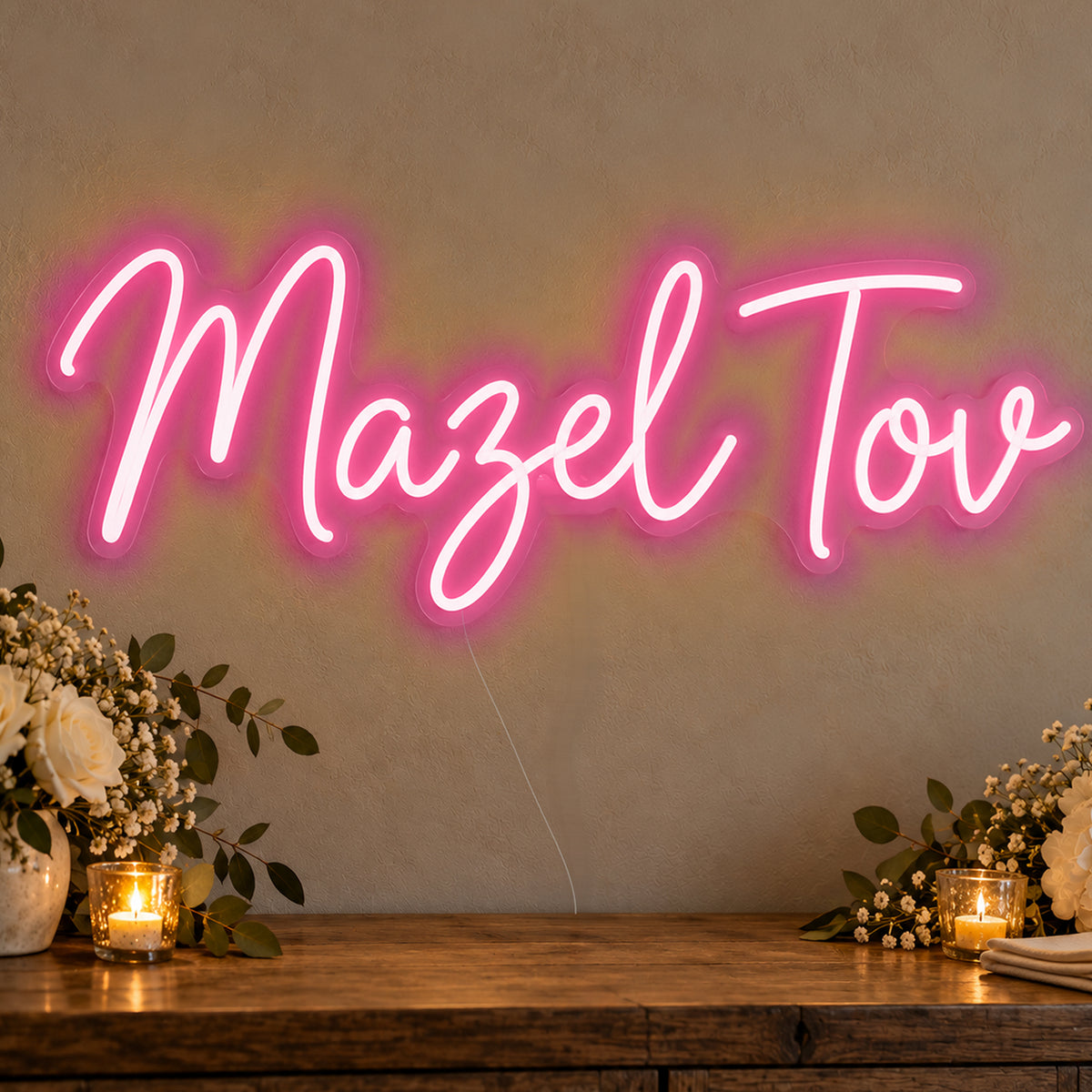 Mazel Tov Neon Sign in rose red LED neon on clear acrylic, angled view