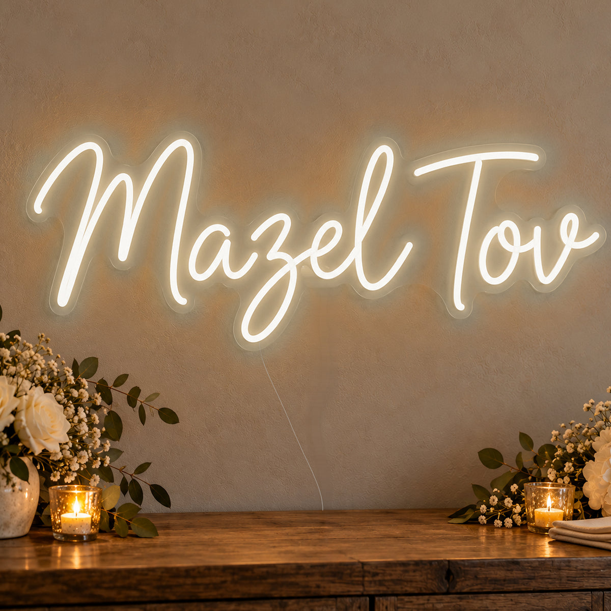 Mazel Tov Neon Sign in warm white LED neon on clear acrylic, angled view
