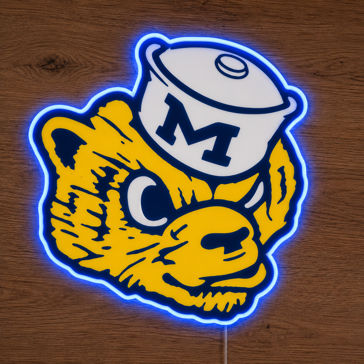 Michigan Wolverines retro mascot LED neon sign in maize and blue on a timber wall