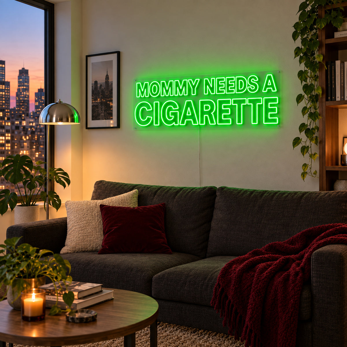 Mommy Needs A Cigarette Neon Sign with green lighting, displayed above a brown sofa.
