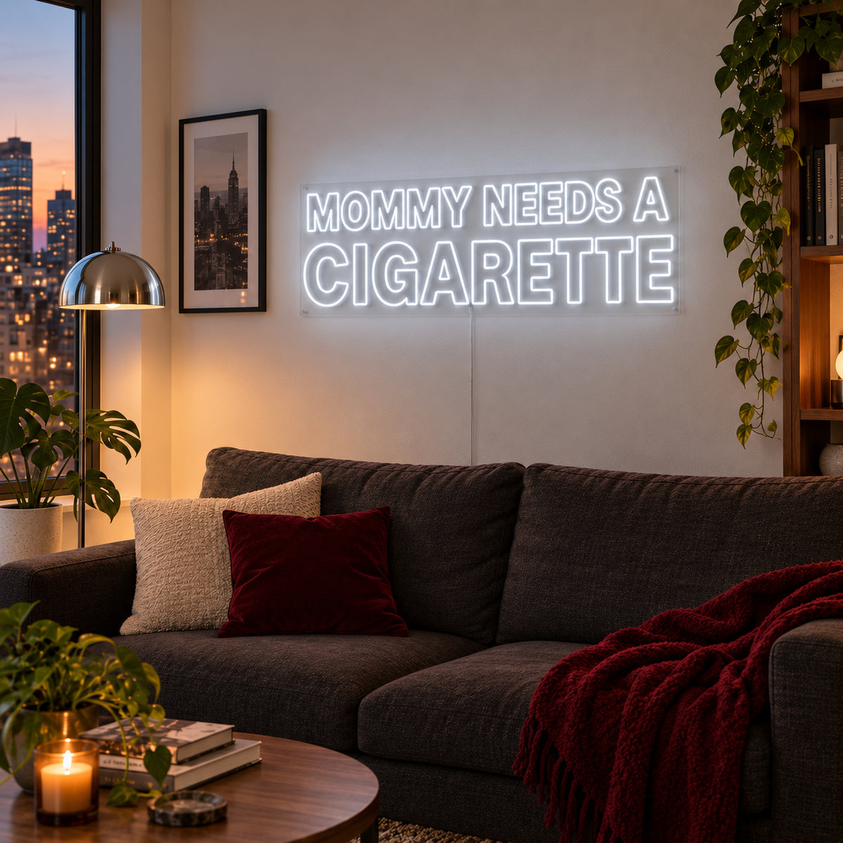 Mommy Needs A Cigarette Neon Sign glowing white above a brown sofa.