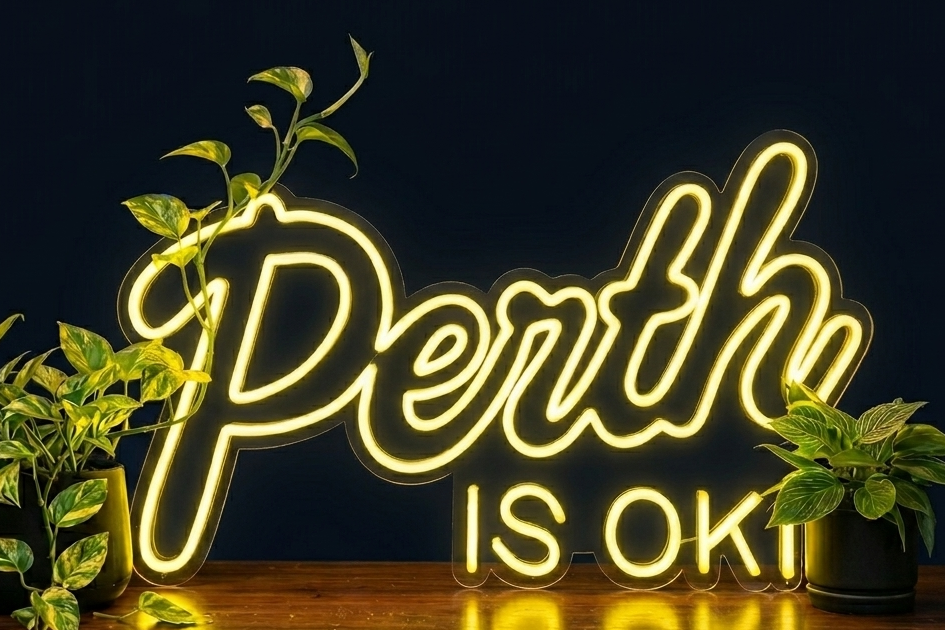 Perth is OK! neon sign on a dark background with plants, shown as custom sign inspiration for Leederville.