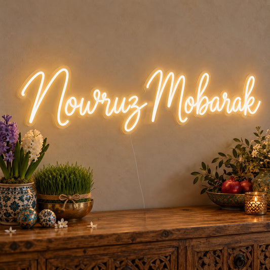 Nowruz Mobarak Neon Sign on clear cut-to-shape acrylic, illuminated on a wall in a styled celebration setting