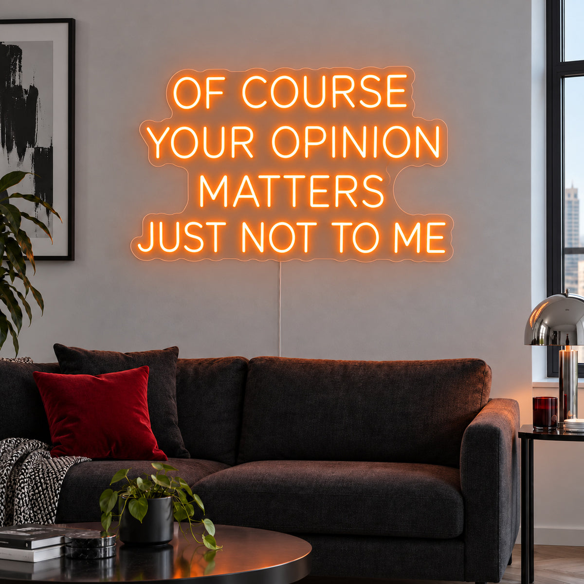 Orange version of the Of Course Your Opinion Matters Just Not To Me Neon Sign, shown above a black sofa.