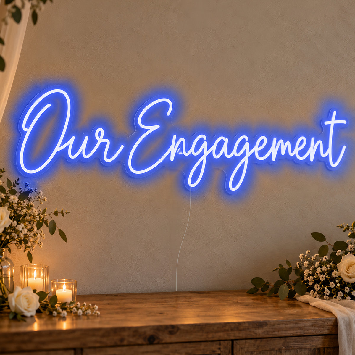 Our Engagement Neon Sign in blue LED neon on clear acrylic, angled view