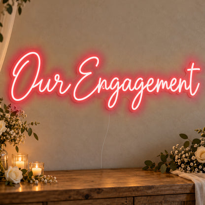 Our Engagement Neon Sign in red LED neon on clear acrylic, angled view