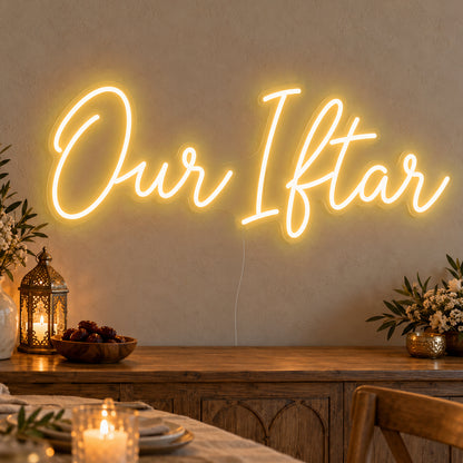 Our Iftar Neon Sign in gold LED neon on clear acrylic, angled view