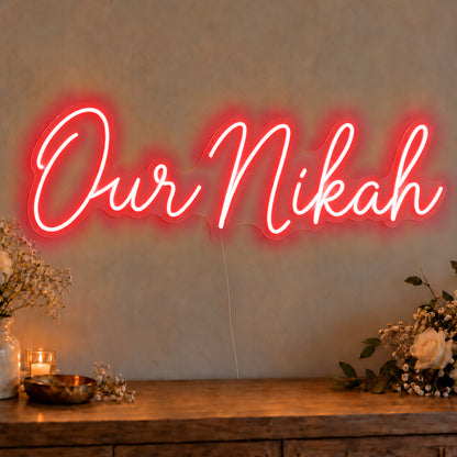 Our Nikah Neon Sign in red LED neon on clear acrylic, angled view