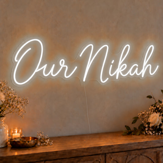 Our Nikah Neon Sign in white LED neon on clear acrylic, angled view