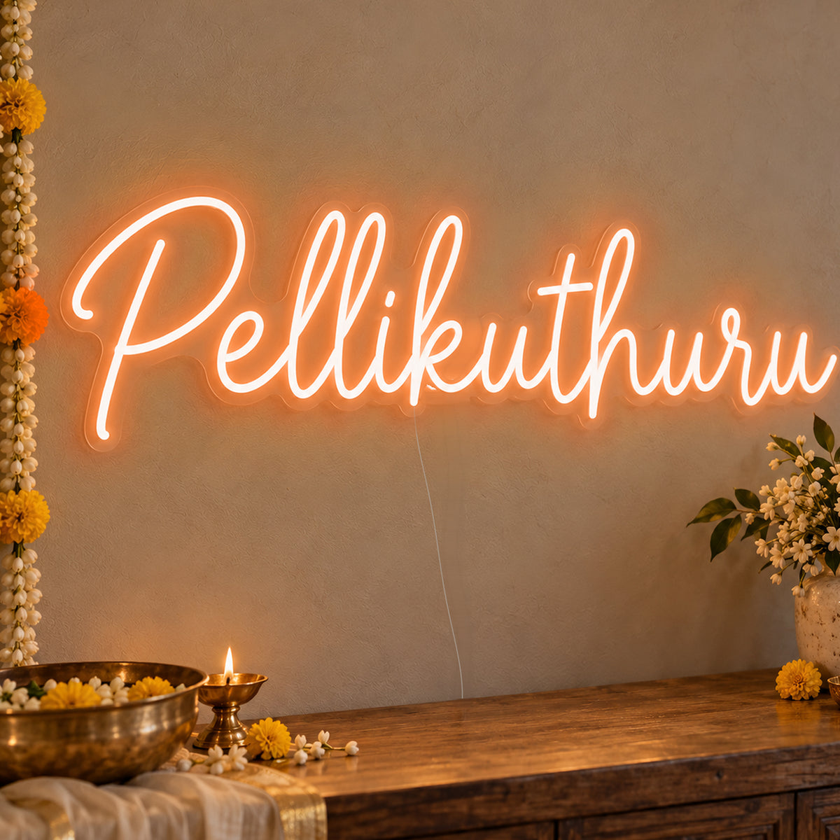 Pellikuthuru Neon Sign in orange LED neon on clear acrylic, angled view