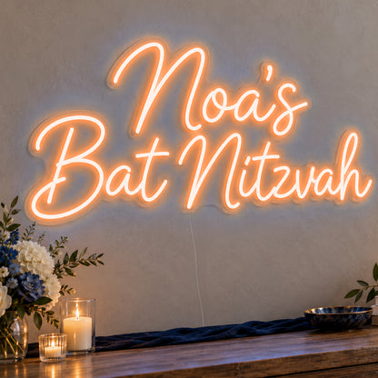 Personalised Bat Mitzvah Neon Sign in orange LED neon on clear acrylic, angled view