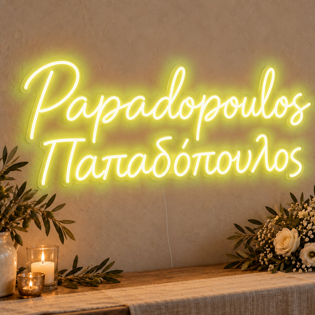 Personalised Bilingual Greek Surname Neon Sign in yellow LED neon on clear acrylic, angled view