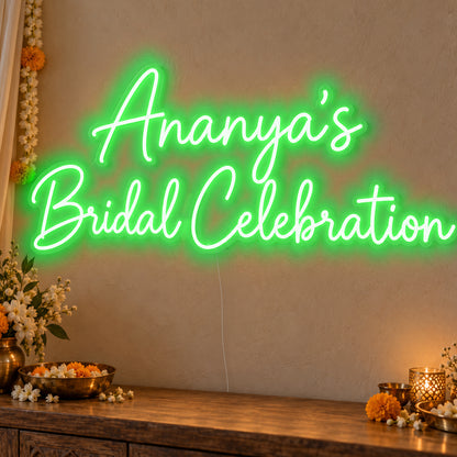 Personalised Bridal Celebration Neon Sign in green LED neon on clear acrylic, angled view