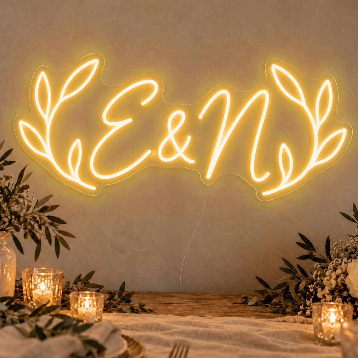 Personalised Olive Initials Neon Sign in gold LED neon on clear acrylic, angled view