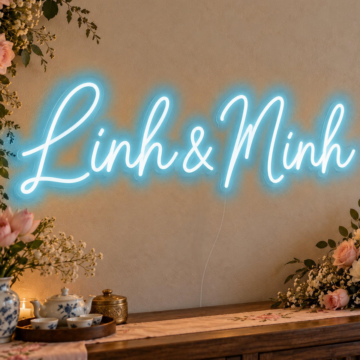 Personalised Vietnamese Couple Names Neon Sign in ice blue LED neon on clear acrylic, angled view