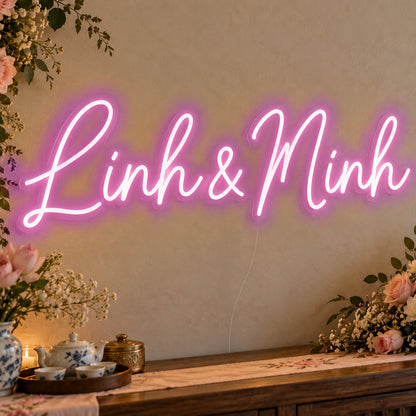 Personalised Vietnamese Couple Names Neon Sign in pink LED neon on clear acrylic, angled view
