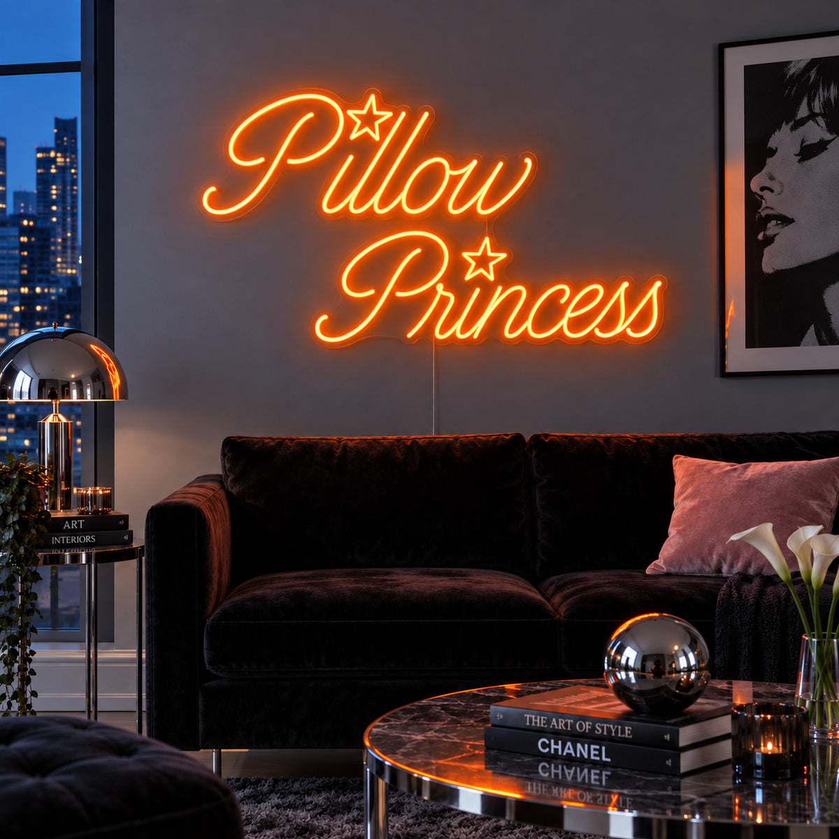 Orange version of the Pillow Princess Neon Sign, shown with star details above a dark purple sofa.