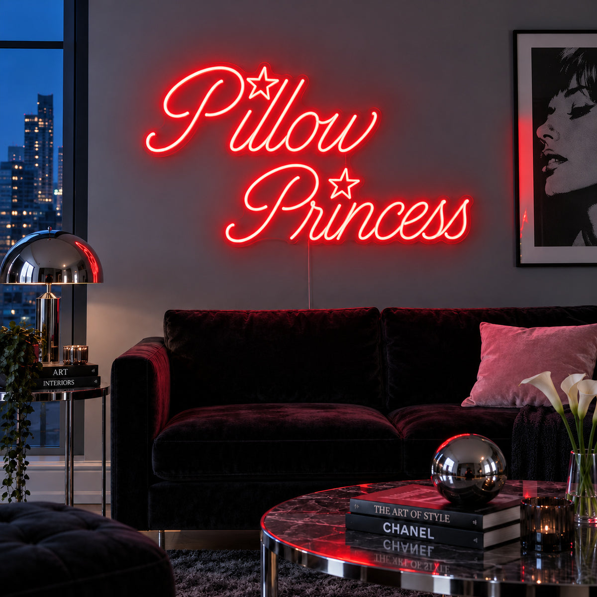Pillow Princess Neon Sign with red lighting, displayed with star details above a dark purple sofa.