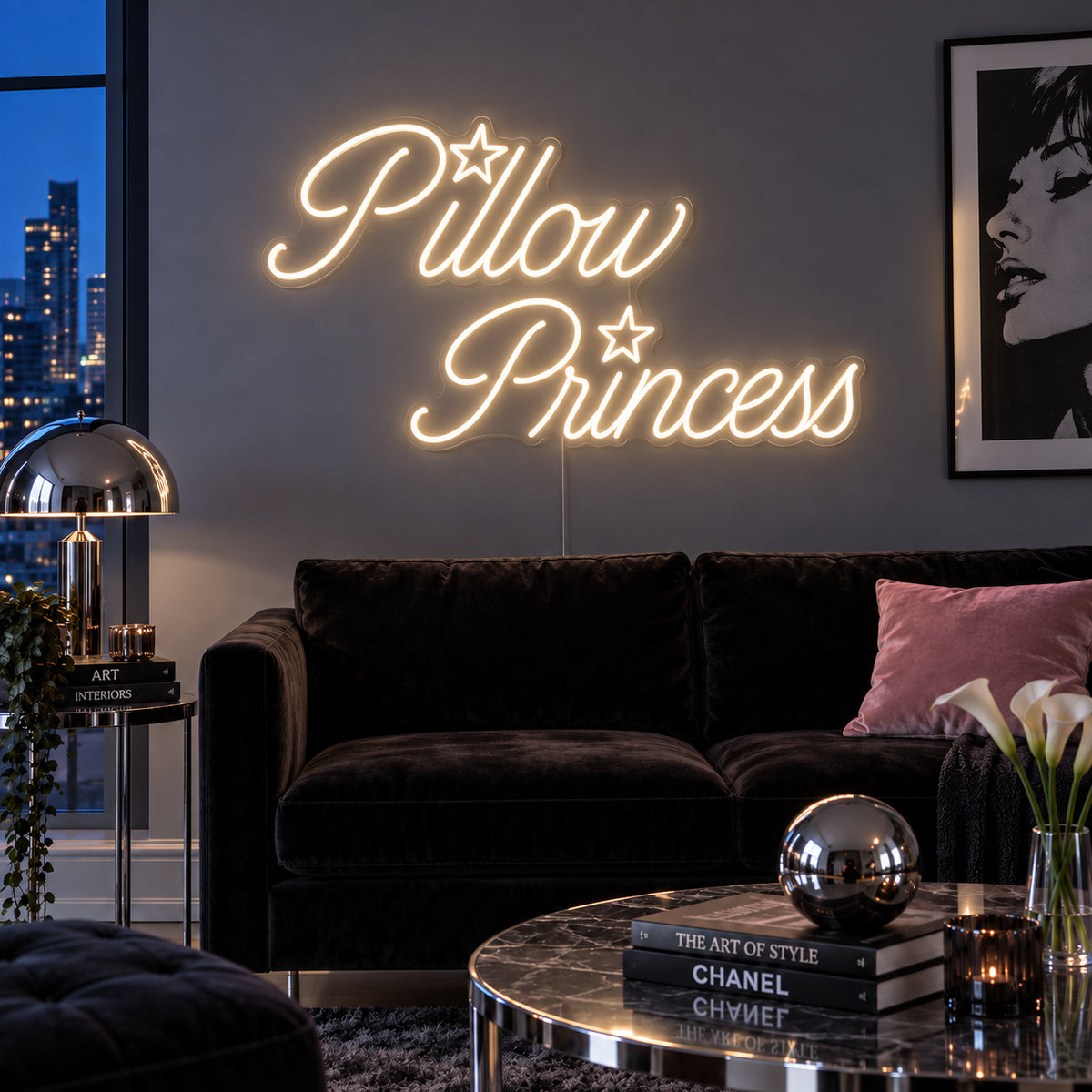 Warm White version of the Pillow Princess Neon Sign, shown with star details above a dark purple sofa.
