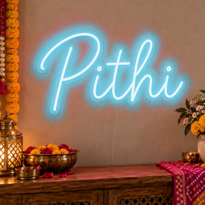 Pithi Neon Sign in ice blue LED neon on clear acrylic, angled view