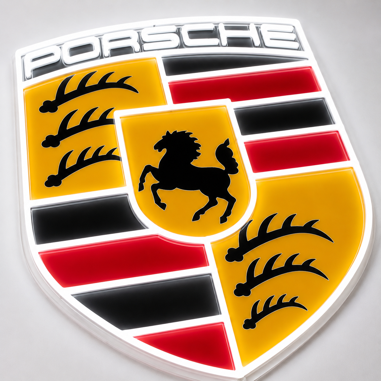 Angled view of Porsche crest shield neon light sign with backlit acrylic finish
