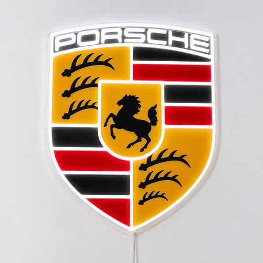 Porsche crest LED neon sign in full colour glowing on a white wall