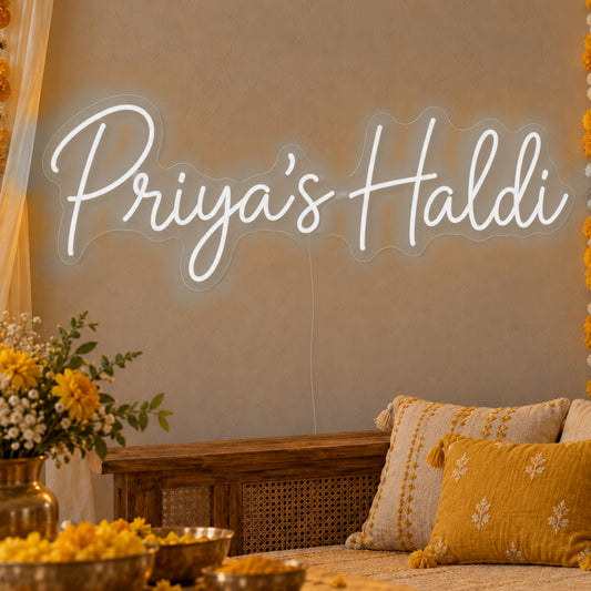 Personalised Haldi Neon Sign in white LED neon on clear acrylic, angled view