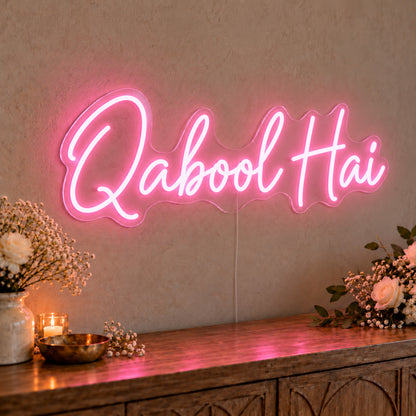 Qabool Hai Neon Sign in pink LED neon on clear acrylic, angled view