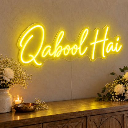 Qabool Hai Neon Sign in yellow LED neon on clear acrylic, angled view