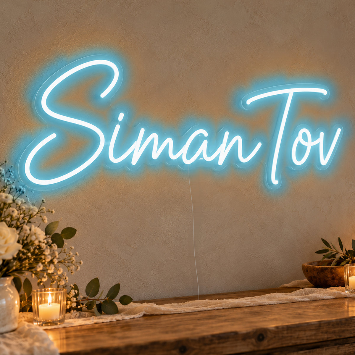 Siman Tov Neon Sign in ice blue LED neon on clear acrylic, angled view