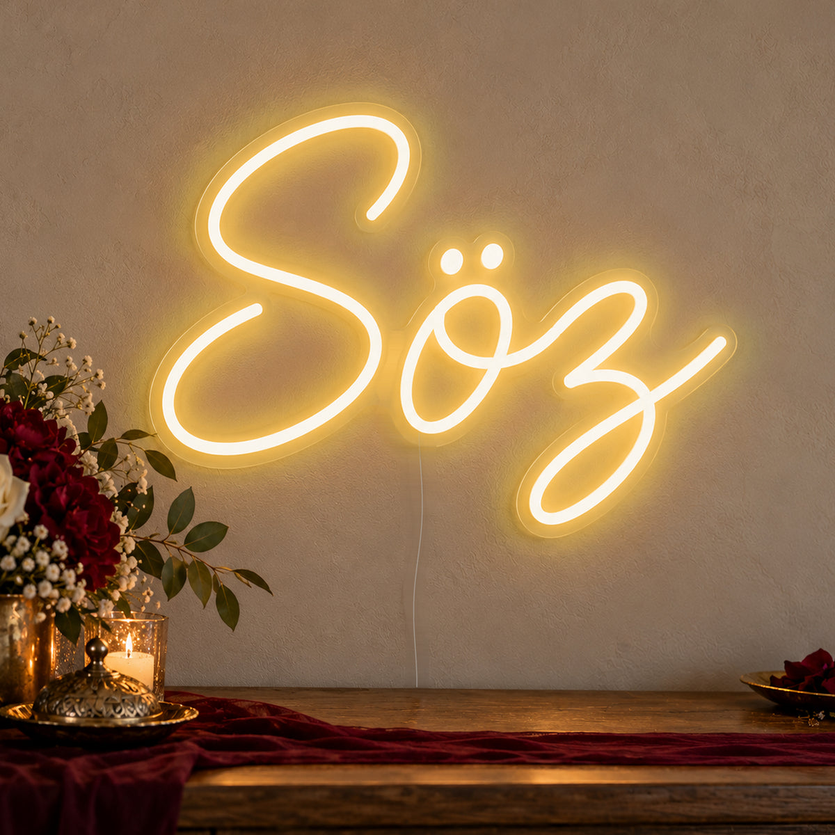 Söz Neon Sign in gold LED neon on clear acrylic, angled view