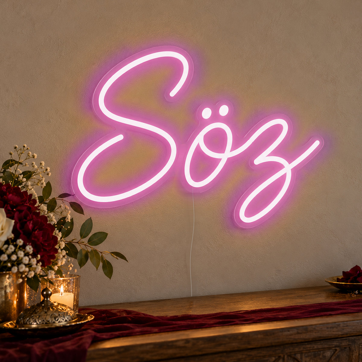 Söz Neon Sign in pink LED neon on clear acrylic, angled view