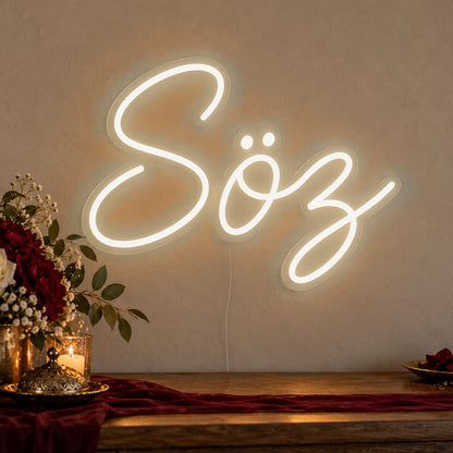 Söz Neon Sign in warm white LED neon on clear acrylic, angled view