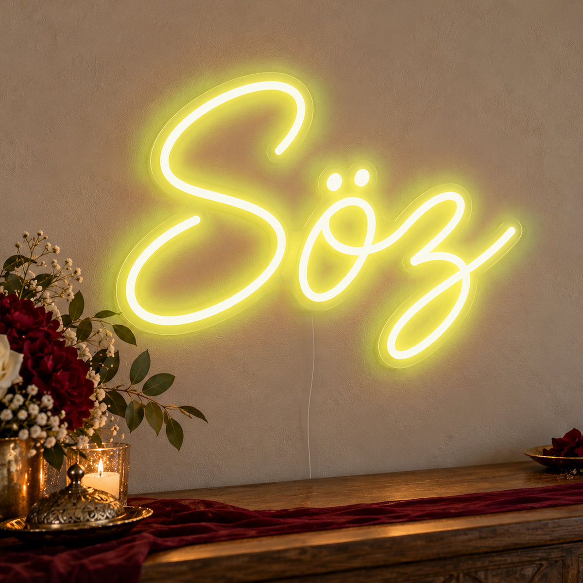 Söz Neon Sign in yellow LED neon on clear acrylic, angled view