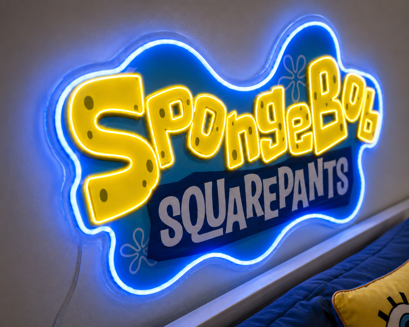 Close-up of SpongeBob SquarePants neon sign with glowing yellow lettering and blue border