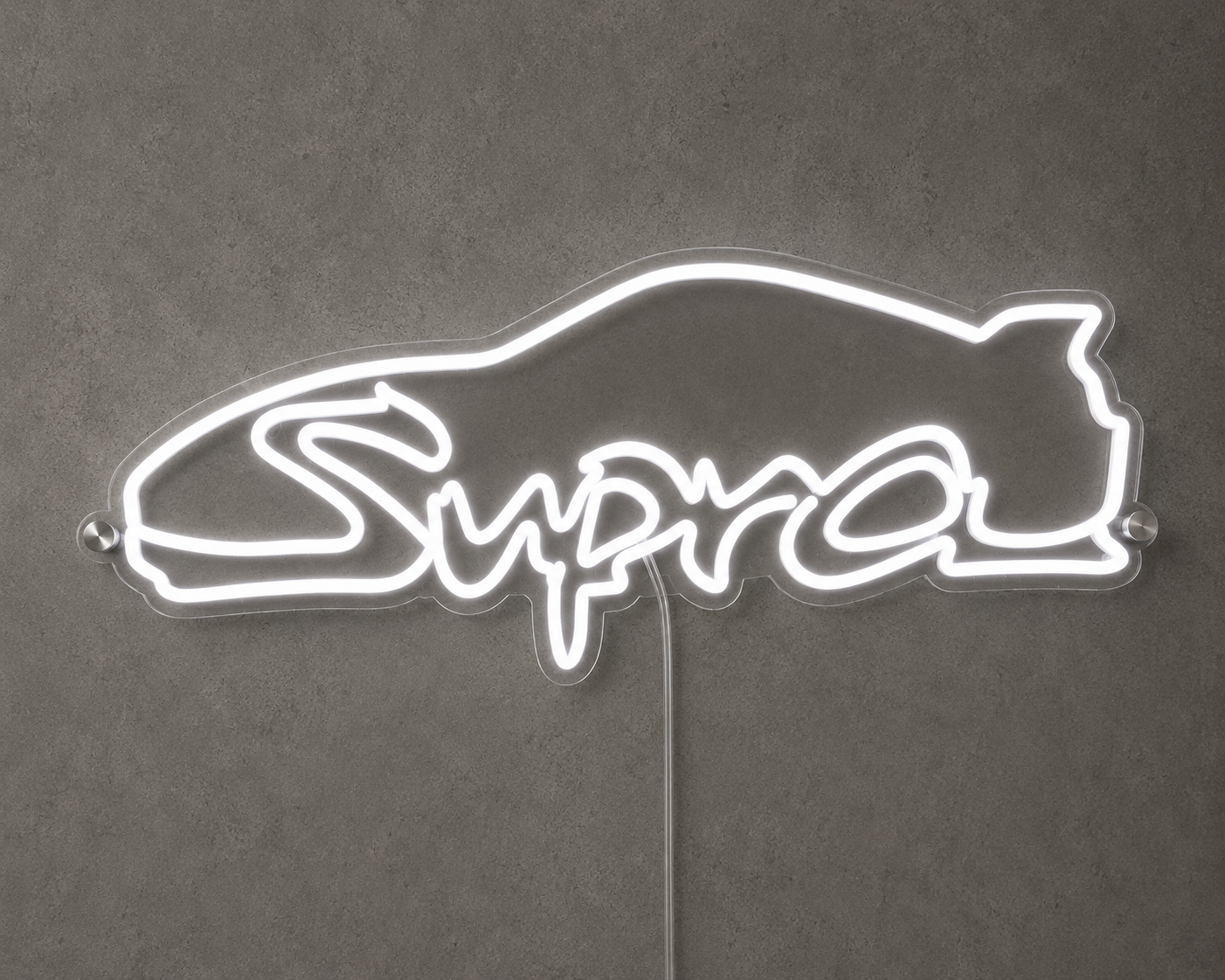 Supra Toyota inspired LED neon sign with white script lettering and car outline on a concrete wall