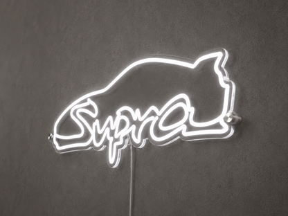 Side view of Supra inspired car silhouette neon light sign on a dark wall