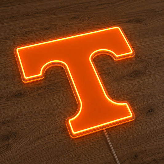 Tennessee Volunteers Power T LED neon sign glowing orange on a timber wall