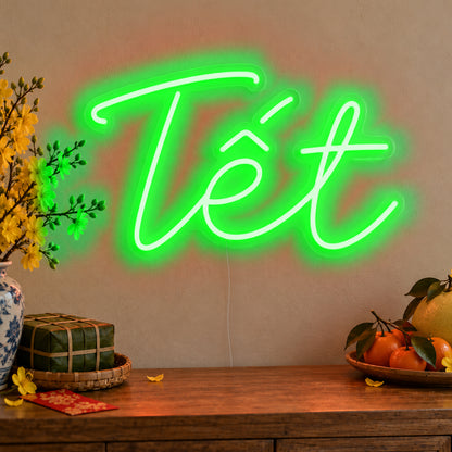 Tết Neon Sign in green LED neon on clear acrylic, angled view