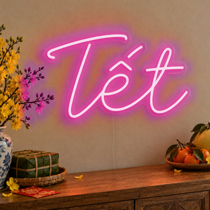 Tết Neon Sign in pink LED neon on clear acrylic, angled view