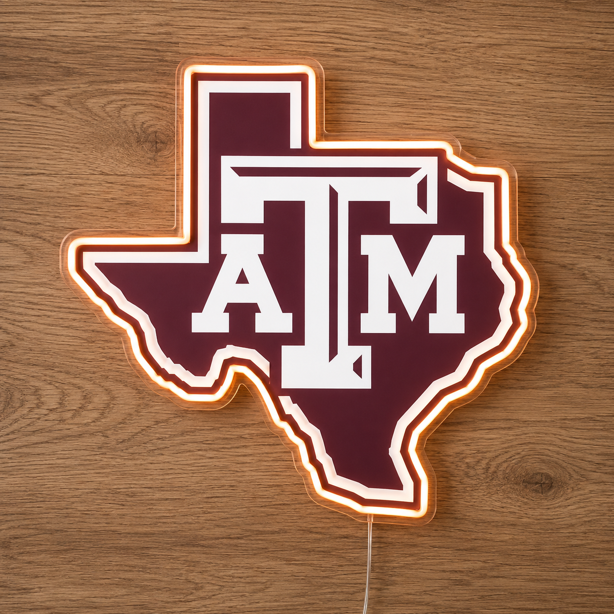 Texas A&M Aggies ATM logo LED neon sign in the Texas state outline on a timber wall