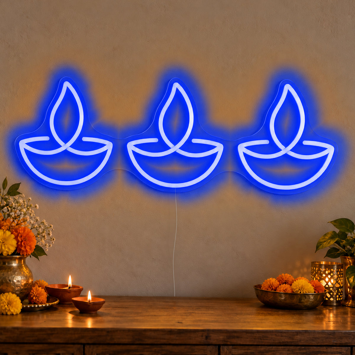 Three Diyas Neon Sign in blue LED neon on clear acrylic, angled view
