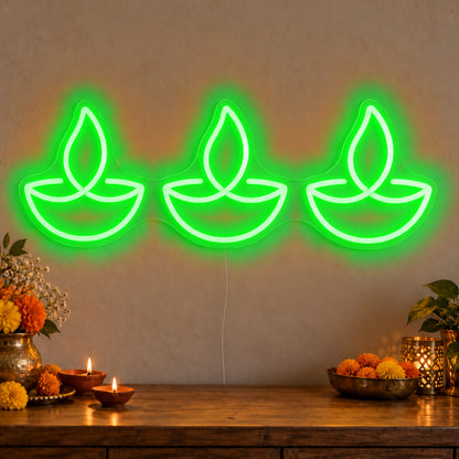 Three Diyas Neon Sign in green LED neon on clear acrylic, angled view