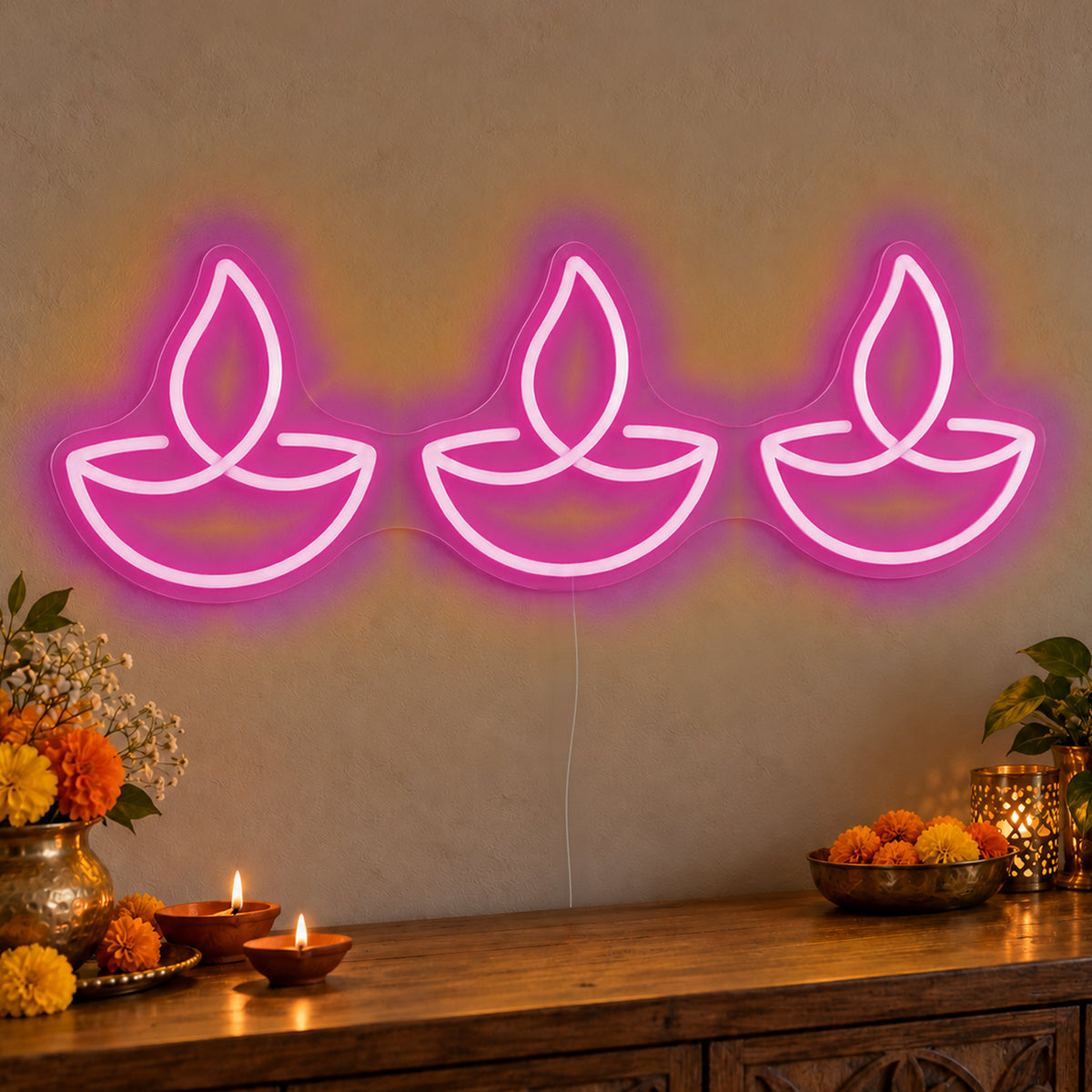 Three Diyas Neon Sign in pink LED neon on clear acrylic, angled view